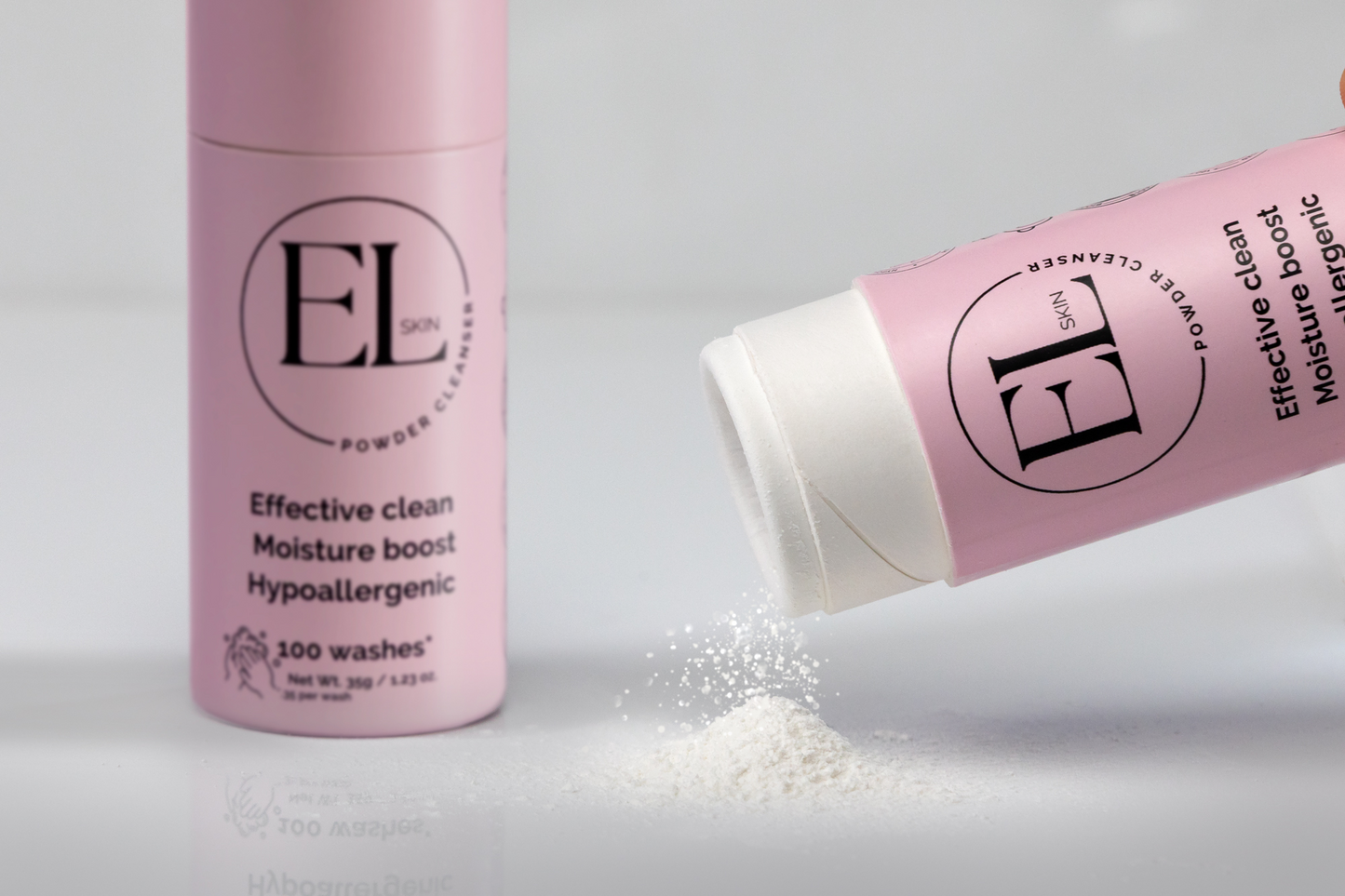 Pink EL powder cleanser with packaging on a light gray background