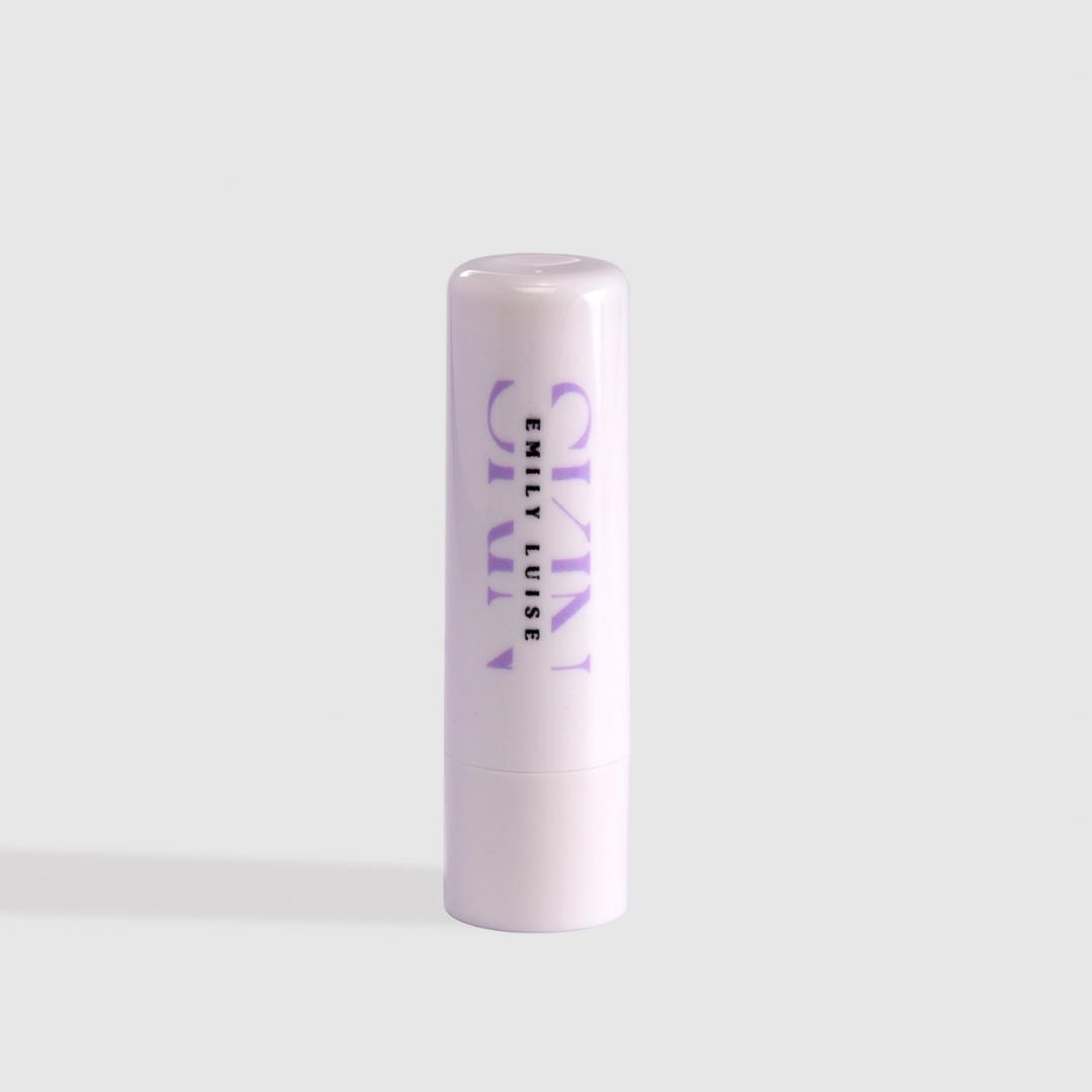 Lip balm with 'emily luise ' branding on a light gray background