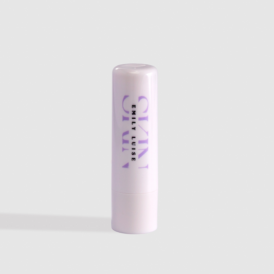 Lip balm with 'emily luise ' branding on a light gray background